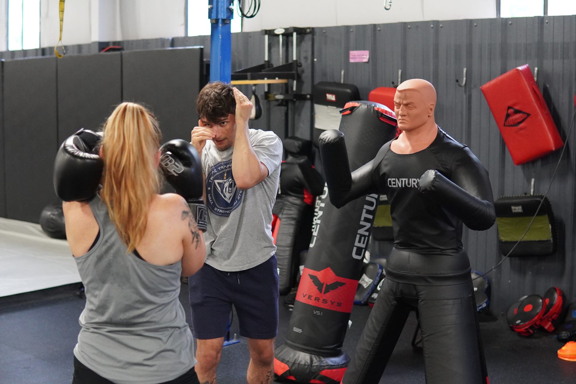 Cole Brackett guiding a student through defensive structure