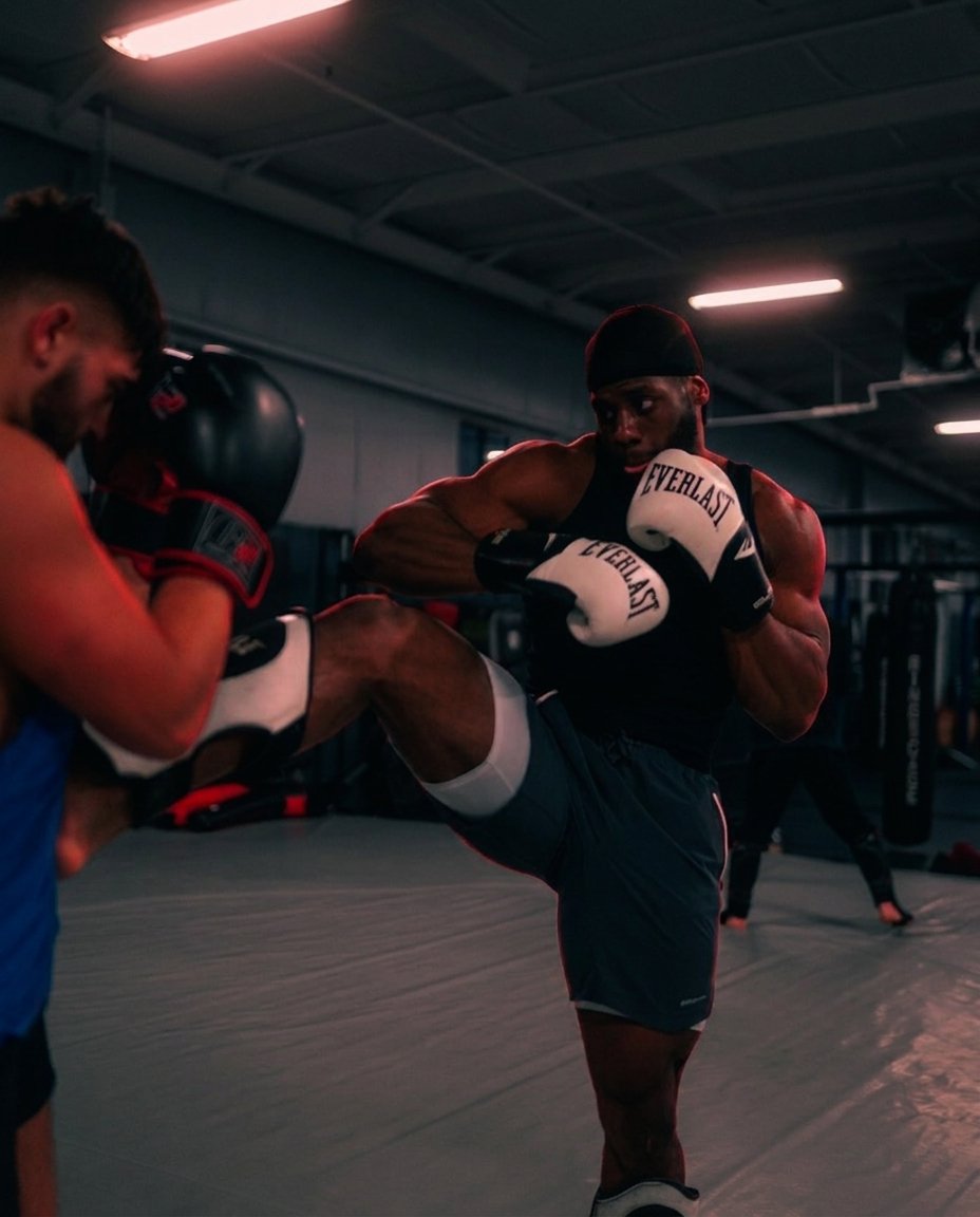 A close-range knee strike drilled on the TRITAC mat
