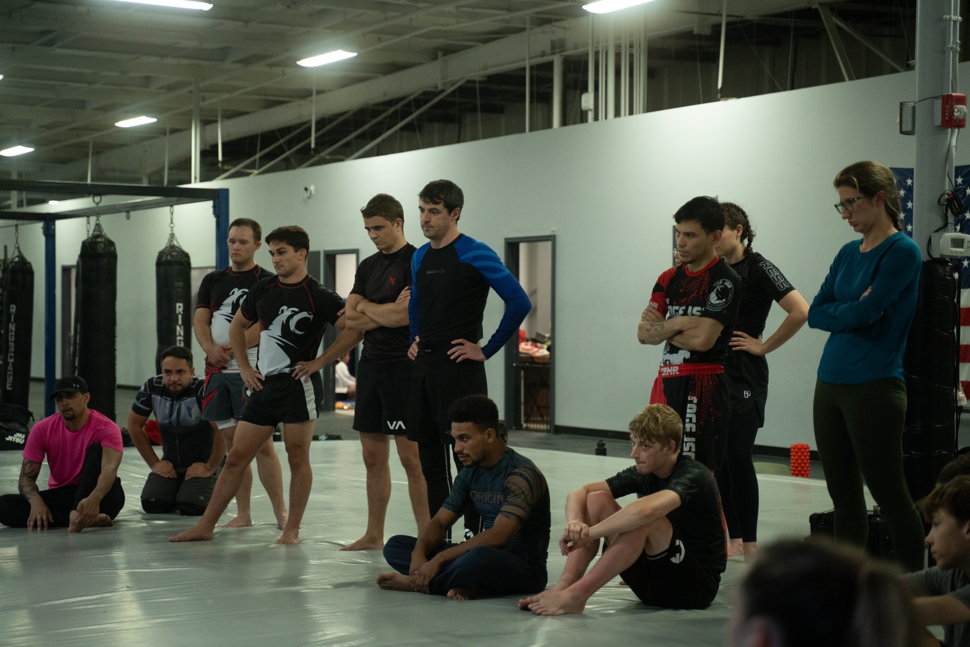 Two training partners working a position on the mat during class