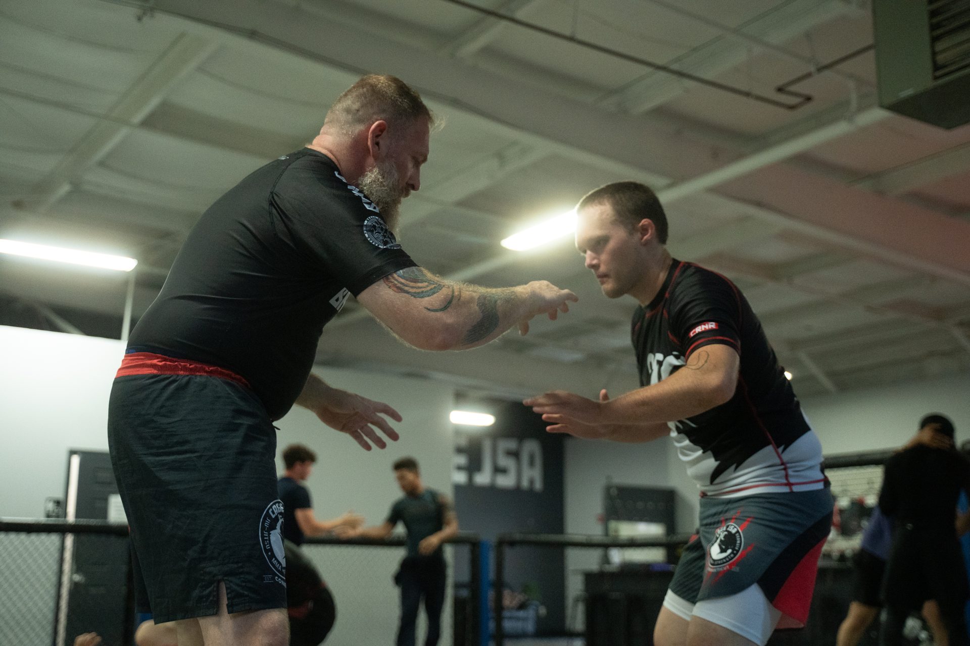 Matt Bryers hand-fighting with a student during a standing drill