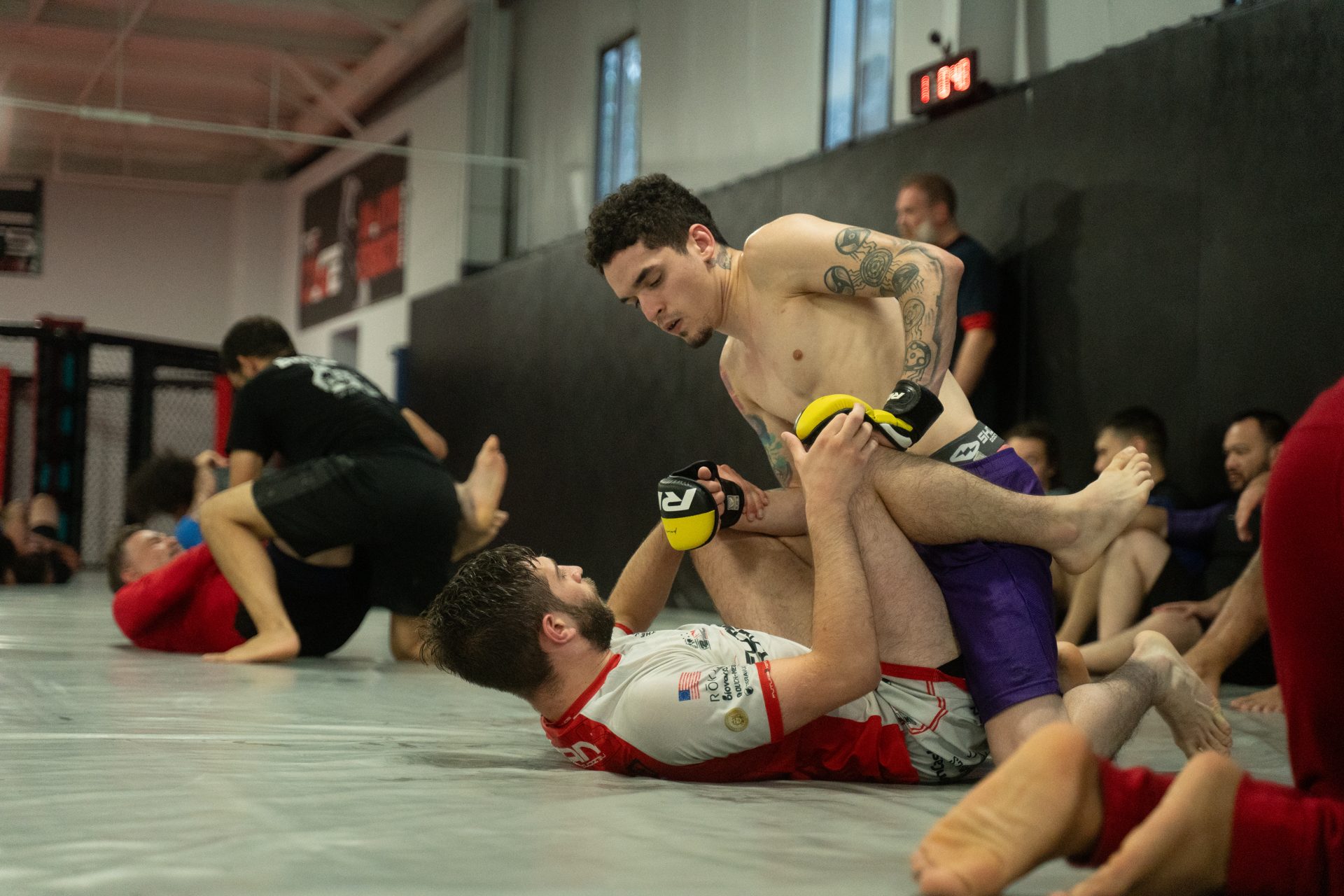 Two members working a position on the ground during class